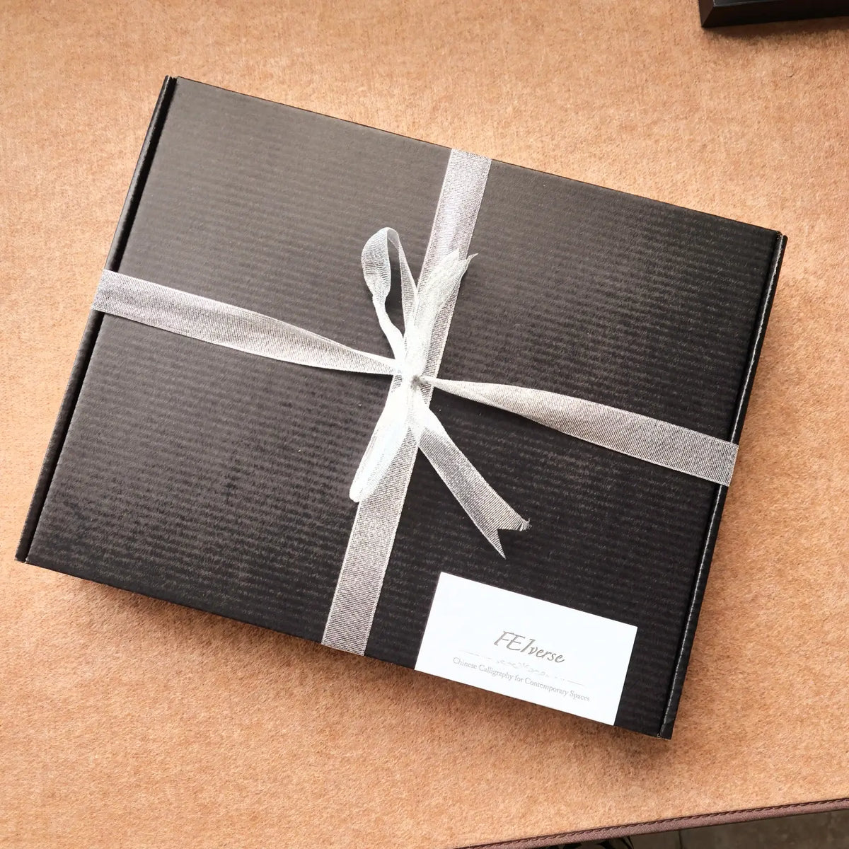 FEIverse Chinese calligraphy artwork protected in gift-ready packaging for safe delivery.