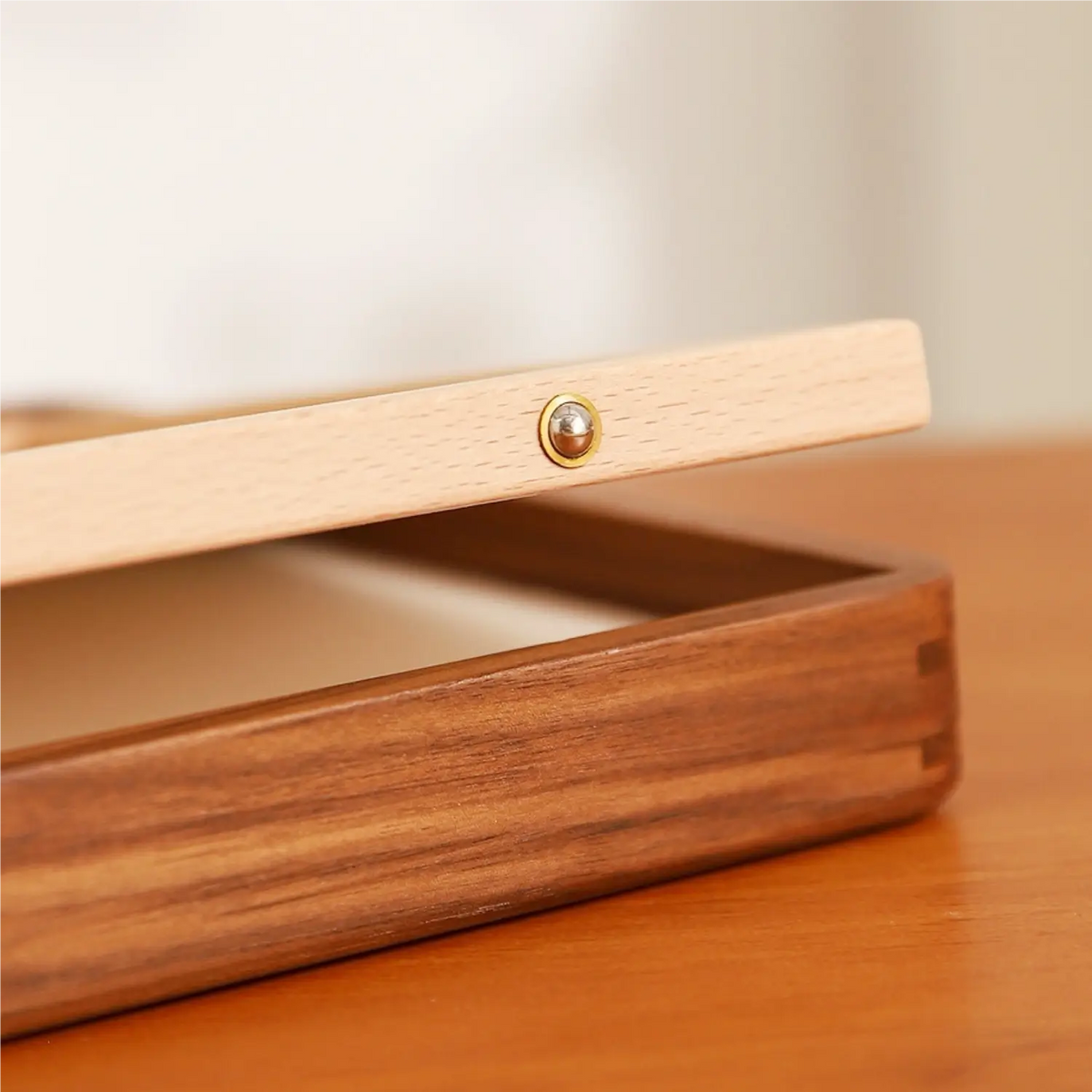 Detail of the dark natural grain and finish of the solid ebony wood frame
. Close-up of the mortise-and-tenon corner construction of the solid ebony wood frame. Side view of the solid ebony wood frame showing its depth and handcrafted construction
